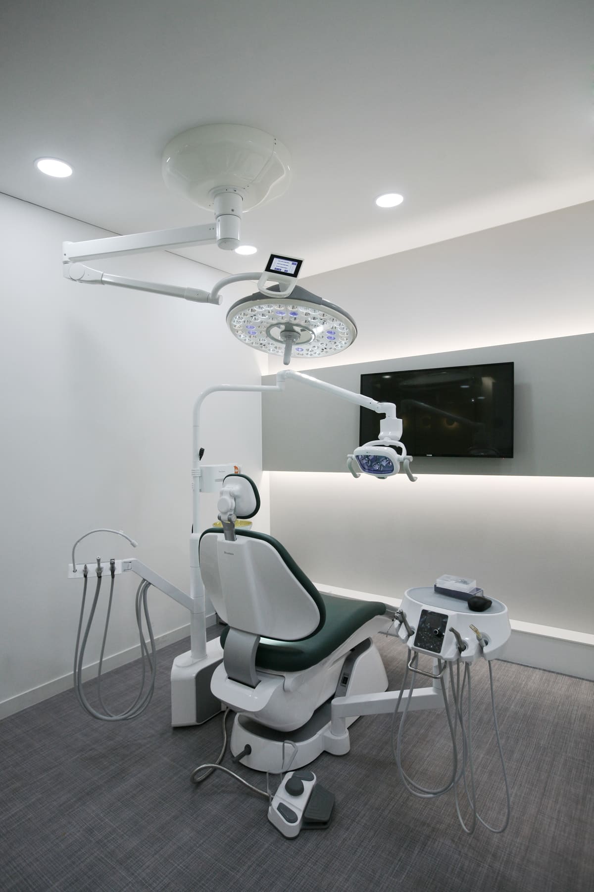 Dedicated implant surgery suite with an overhead surgical light at Seoul Today Dental Clinic